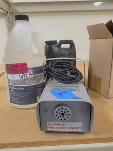 lot 1433 image: The Fog Machine 62264 and 2 Gallons of Fog Solution