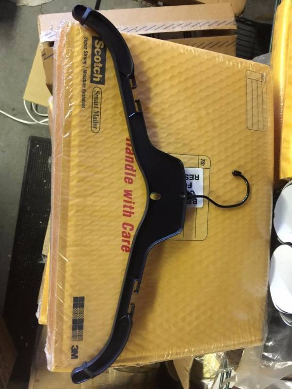 lot 75 image: Case of 50 black coat hangers with rubber pro...