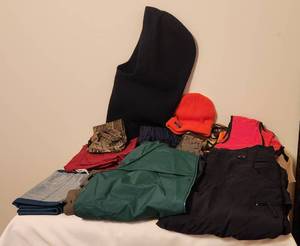 lot 1052 image: Hunting Outer Wear - Air Walk Water Resistant Pants size Large - Redhead Rain Pants, Large - Columbia Rain Jacket, Large - 1 Camo Vest - 2 Orange Vests - Beanie and Full Head and Neck Beanie - Pouch and Belt - Equipment Nylon Bag 38 x 29. See Pictures