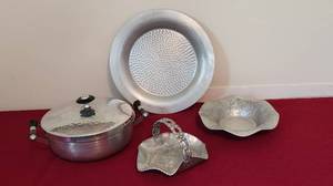lot 1082 image: Forged Aluminum Vintage Covered Dish Spain - and Vintage Aluminum Serving Bowl, shallow Hammered Base 12 - Everlast 8 Hand Forged Fluted Bowl, Grapes & Leaves - Vintage Hand Wrought & Hammered Aluminum Candy Dish 6x7x4.5 Rodney Kent