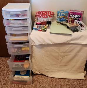 lot 1114 image: 7 Drawer Sterlite Plastic Storage Unit on Wheels 13x15x40, Includes All Craft Materials in Drawers & on Table. See Pictures