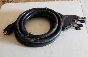 lot 2044 image: 220 Volt 25ft Extension Cord Converts to (4) 110 Volt Plug Ins