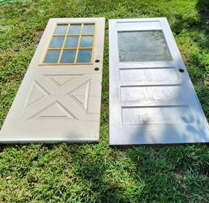 lot 505 image: Exterior Doors - (1) Vintage Wood Door 77 x 32 and (1) Metal Door 78 x 32