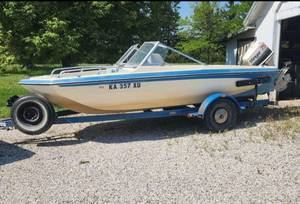 lot 500 image: 1979 Glastron Sportster XL 16ft Tri-hull Boat with 75HP Johnson Stinger Outboard Motor on 16ft Vans Trailer and Many Accessories