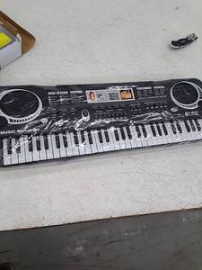 lot 53869 image: 61 Key Bandstand Electronic Toy Keyboard