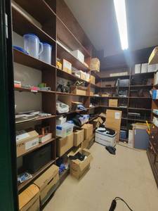 lot 15599 image: Contents of Shelf - Assortment of Paper, File Organizers, Computer Moniter Holders, Apple Iphones, and More