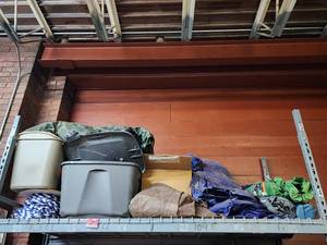 lot 47018 image: Contents of Shelf, Including Tarps, Lawn Chairs, and More