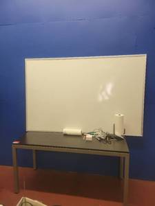 lot 15682 image: 6ft Whiteboard and a 5ft Dark Brown Wood Laminate Work Table W Metal Base