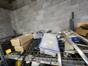 lot 47035 image: Contents of Shelf Including Discontinued EnPhase Trunk Cable, Enphase Cable Terminators, Cable Bracket Holders and More