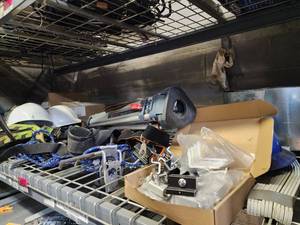 lot 47036 image: Contents of Shelf Including Bosch 36in BT 160 Professional Tripod, Miller Safety Harnesses, Hard Hats and More