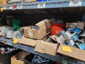 lot 47040 image: Contents of Shelf Including Iron Ridge Racking, Eaton 200A Meter Sockets, Unirac U-Clamp Ground Mounts, Install Torque Valves and More