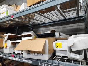 lot 47043 image: Contents of Shelf Including Renusol Module Clamps, S-5 Module Clamps, Top Tee Clamps, and More
