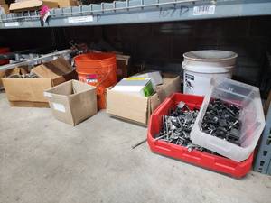 lot 47045 image: Contents of Shelf Including UniRac End Clamps, Dome R 2 Bases, Installation Fasteners, And More