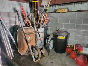 lot 15789 image: Assortment of Gardening  Shop Supplies - Rigid Benders, Wheel Barrals, Shovels, Gas Cans, and More