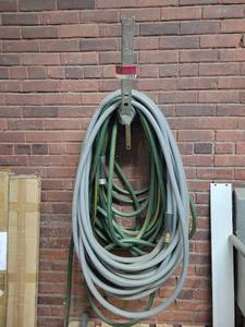 lot 15792 image: Lot of 2 Water Hose and Wall-Mount Rack&nbsp