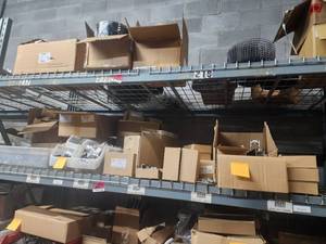 lot 47047 image: Contents of Shelf Including, Hard To Find Discontinued Roof Tech, Solar Panel Rack Mounting System, Discontinued Roof Tech Air Mounts, And More