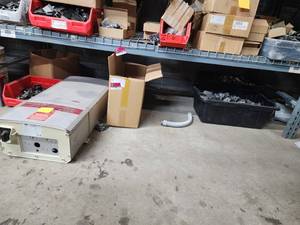 lot 47049 image: Contents Under Shelf Including, Fronius IG Plus Inverter, End Clamps, Mounting Systems, and More