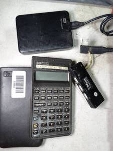 lot 33553 image: Misc Electronics  WD Portable Drive  HP 20S Scientific Calculator  USB Hub