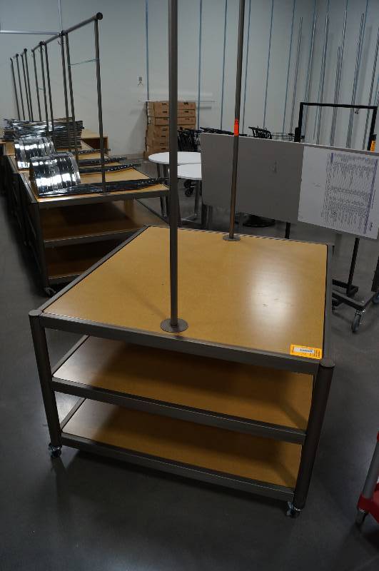 lot 7053 image: Rolling Jean Display Rack