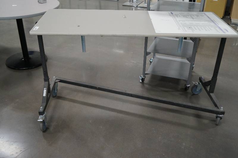 lot 7059 image: Rolling  side folding table