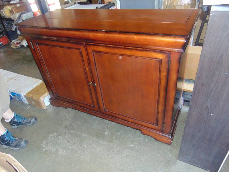 lot 7196 image: Entertainment Console Cabinet, Is set up for track system to raise an lower TV, 61 x 23 41tall, track system and TV not included