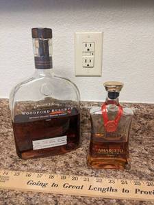 lot 257 image: Woodford Reserve & Amaretto Bottles