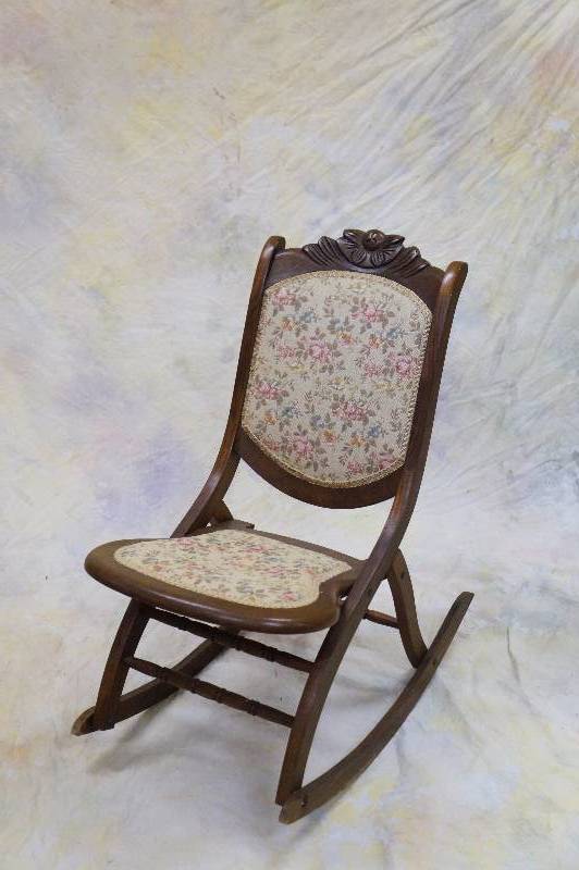 lot 1 image: Folding antique rocking chair.