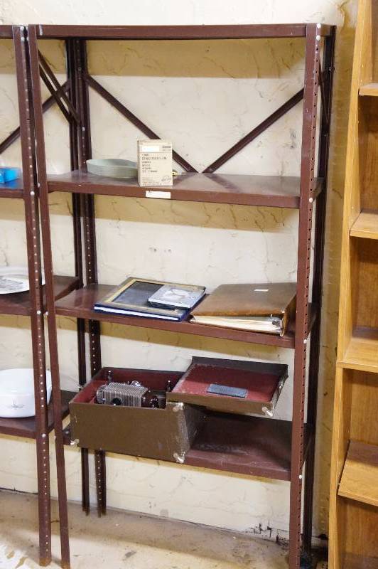 lot 15 image: Brown metal shelf 5.5 & contents, movies projector, & photo albums.