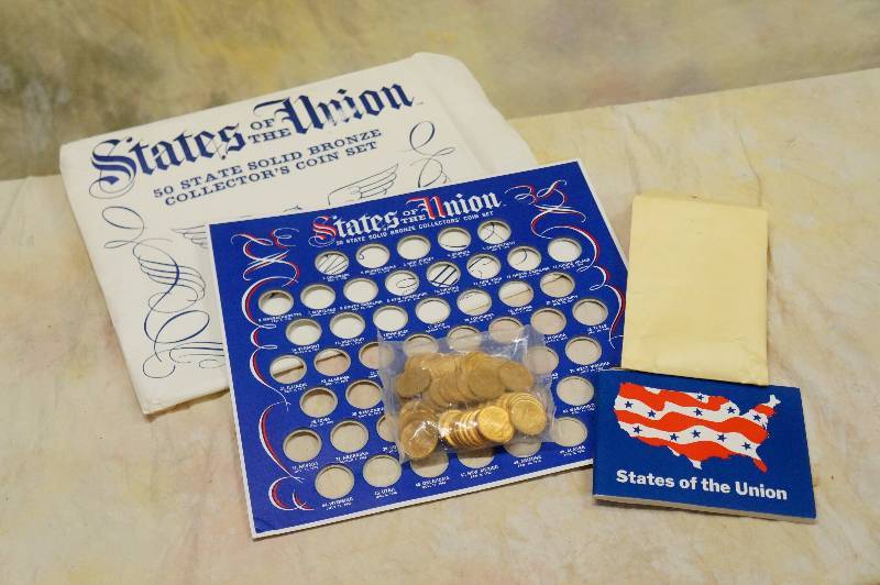 lot 37 image: States of the union 50 state bronze collectors coins mint unopened in sealed plastic.