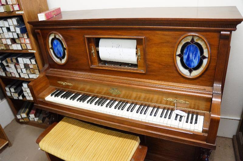 1930's Universal player piano around 200 rolls. East Wichita Estate