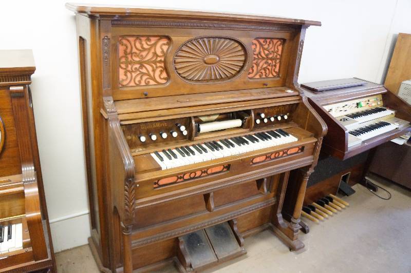 lot 69 image: Wilcox & white pump player piano, the pump action works but the player part does not.