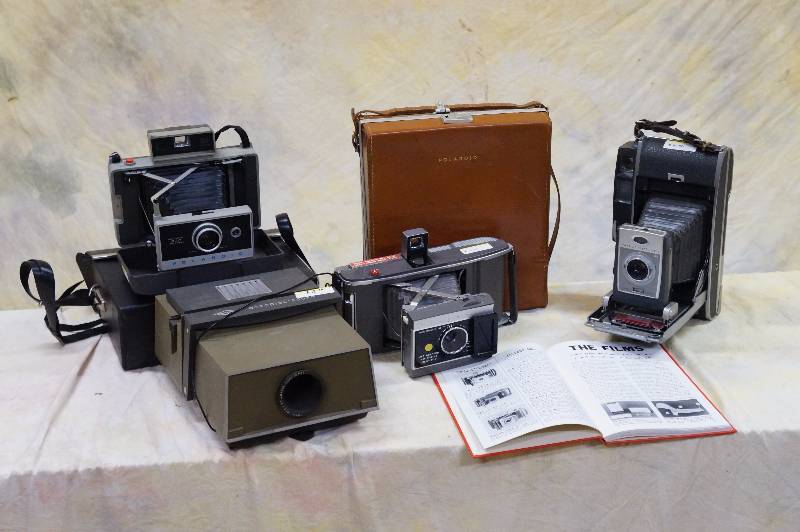lot 96 image: Lot of three large polaroids & a projector.