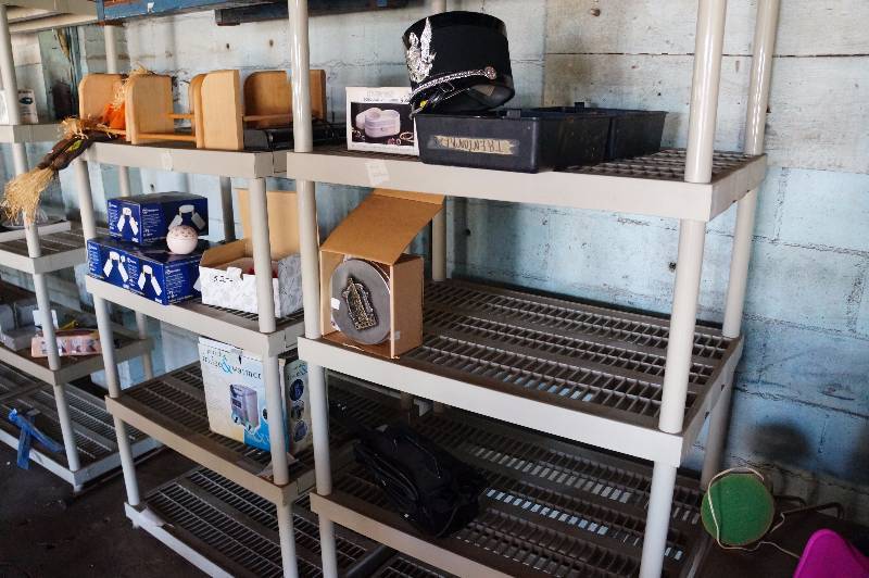 lot 145 image: Contents only on two shelving units, cd racks, lights, brand hat & misc.