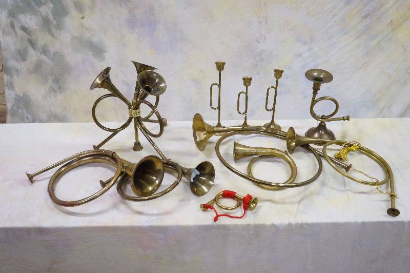 lot 153 image: Lot of 12 brass trumpets, 3 are candle holders.