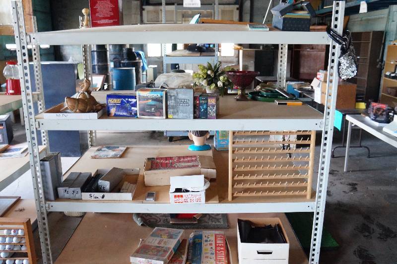 lot 170 image: Entire contents of shelving unit, games, cooler, copy stand, glass post cards, misc(shelf not included).