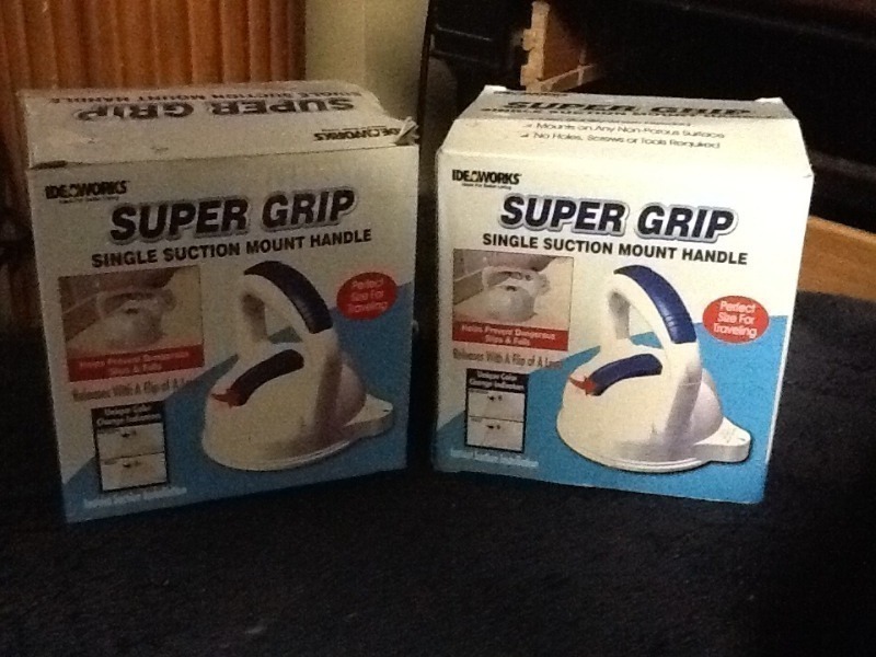lot 10 image: Two super grip suction mount handle use in business or home many uses