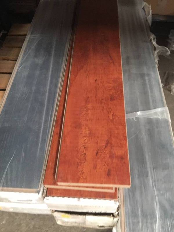 lot 1067 image: 5 Boxes17 sq ft of 12MM Red Wood Laminate Flooring