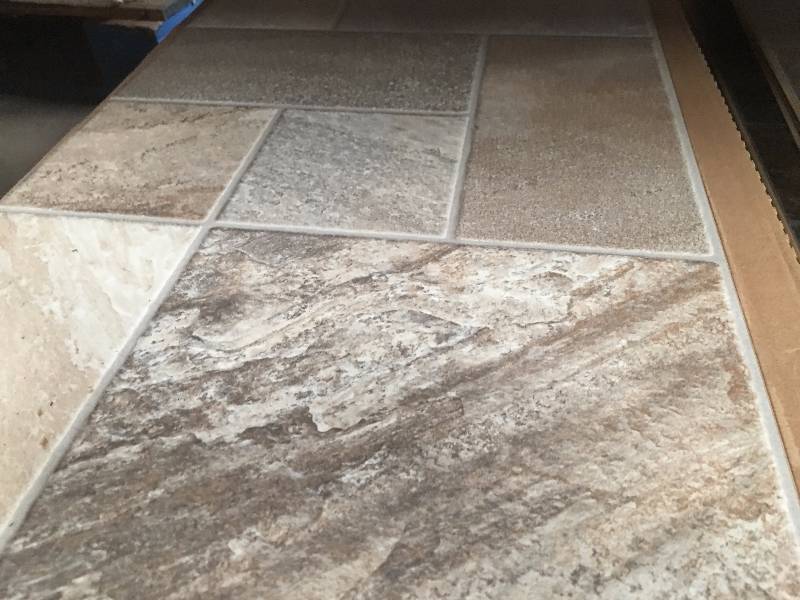 lot 1069 image: 4 Boxes88 sq ft of 8MM Gray Mist Laminate