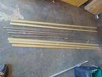 (9) ct lot wood flooring trim with metal mounting strips; (5) trim pieces 8 ft strips, Honey Oak Color; (4) metal brackets 8 ft