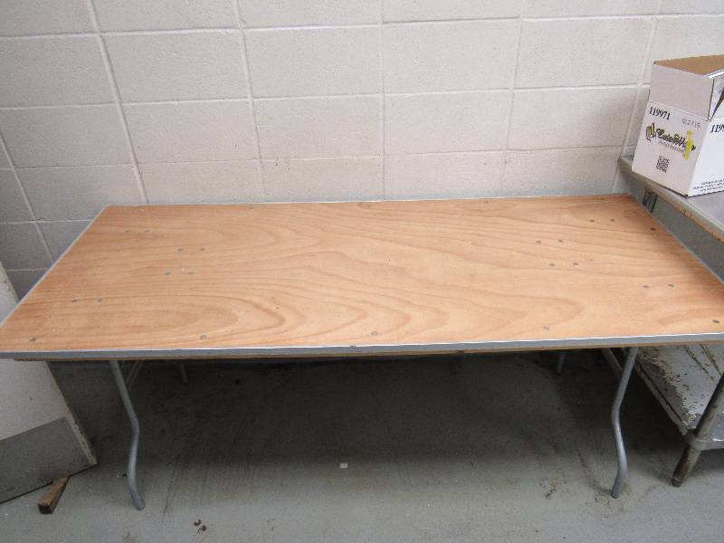 lot 1622 image: 72 X 30 Wood Work Top Table With Metal Edging On Folding Metal Base