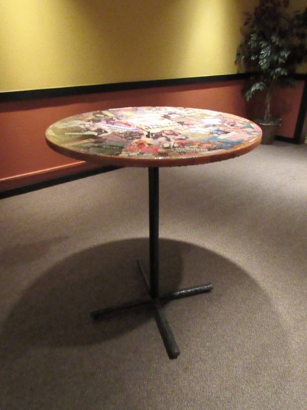 lot 1795 image: 36 Round Bar Height Table With Kansas City Entertainment Collage On Top