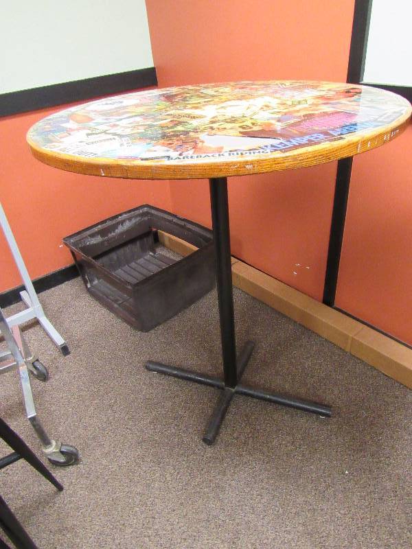 lot 1798 image: 36 Round Bar Height Table With Kansas City Entertainment Collage On Top