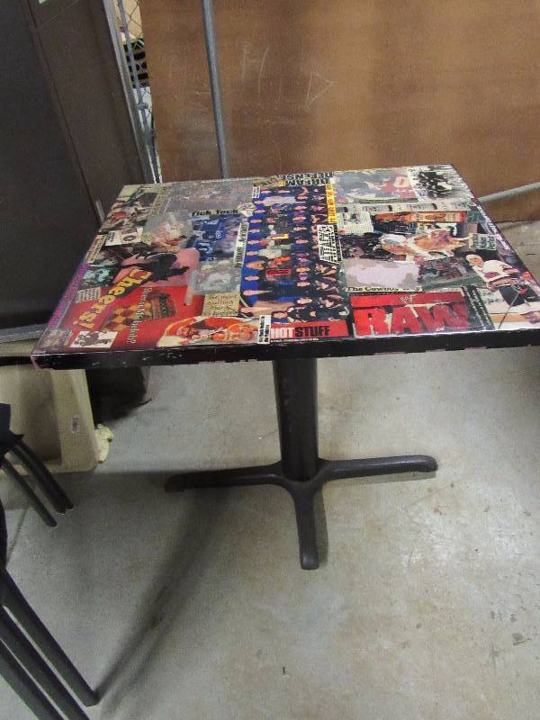 lot 1829 image: 30 X 24 Standard Height Table With Kansas City Entertainment Collage On Top