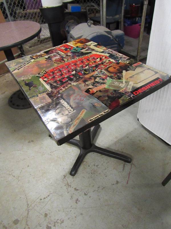 lot 1830 image: 30 X 24 Standard Height Table With Kansas City Entertainment Collage On Top