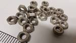 25 new 3/8 coarse thread jam nuts slightly tarnished but new pieces