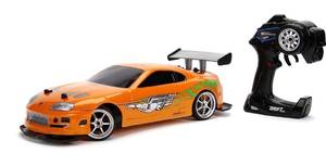 lot 30412 image: Jada Toys Fast & Furious 110 Toyota Supra Remote Control Car Drift Slide RC with Extra Tires 2.4GHz, Toys for Kids and Adults Orange,black