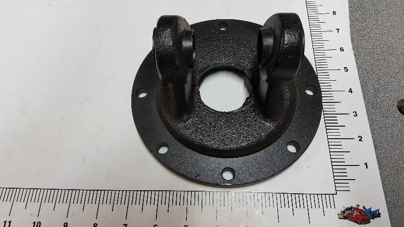 lot 7069 image: Its new and its big is this universal joint flange with bearing race and 7 bolt holes