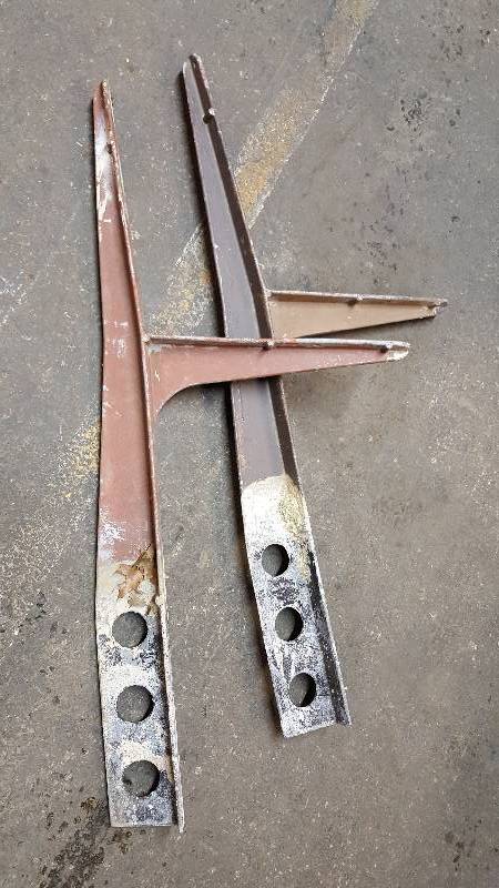 lot 7073 image: Park bench stands aluminum forgings.  Saved from a tear out in an expensive park is this pair.