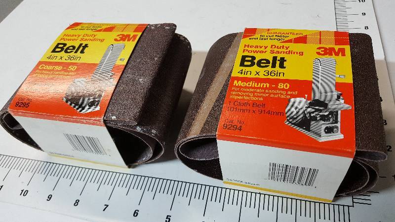 lot 7075 image: 1 new and 1 slightly used is this 3M HD power sanding belt 4 X 36 with Medium 80 grit