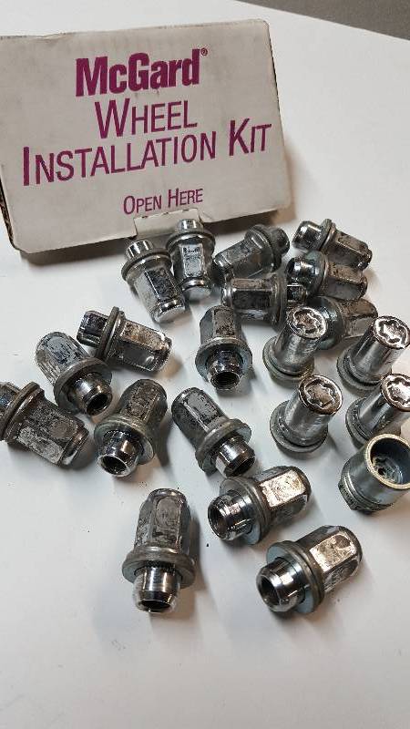 lot 7079 image: Full set of 20 McGard brand mag wheel shank type lug nuts and washers with McGard locks and key for the 12MM X 1.5 threads